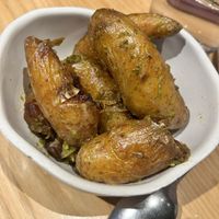 Roast Potatoes, Green Chilli Zhoug Butter  at Nomad in Surry Hills