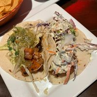 Bang Bang Cauliflower taco (left) and Sweet Potato Black Bean taco (right). at Red Star Taco Bar in Tacoma