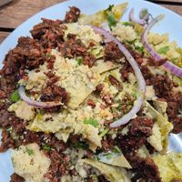 Chilaquiles light de nopal version vegana, con proteína vegetal de Better Balance, queso de Almendras y crema vegetal. at Giornale Cafe Palmas in Mexico City