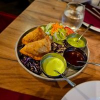 Samosa but careful, some of the dips they bring are not vegan. The red one definitely is and tastes sweet at Chakra in Tallinn