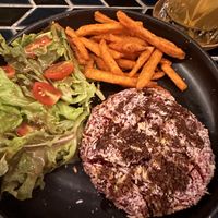 Beetroot hamburger, side salad, sweet potato fries.   at The Lunar Beach House in Chonburi