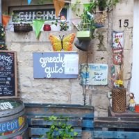 Courtyard with entrance at Greedy Guts in Caen