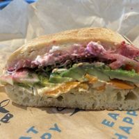 Happy hippie made vegan by omitting cheese, dill ranch dressing, and dubbing ciabatta bread - so good!   at Mendocino Farms in Sacramento