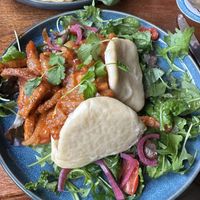 Sticky chilli tofu on bau bun and sesame oil dressed salad.  at Three Cups Inn  in Malmesbury