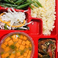 5 in 1 mealbox: Fried rice, vegetarian stuffed tofu with mushroom medley, stir fried green beans with garlic, cabbage pickle and potato soup with carrot  at Vn Street Foods in Marrickville