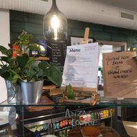 Part of the café counter: vegan cheese option made clear! at Oxford House Café in East London