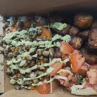 Plat du moment/daily special: white rice and chickpeas with Nanji sauce, tomato salad and plantain, plus extra green sauce at Osè African Cuisine  in Paris