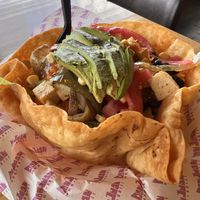 Crispy Taco Salad with spiced tofu, sautéed veggies, pickled onions, black beans, Mexican rice, lettuce, avocado, and salsa   at Don Juan Mex Grill   in Easton