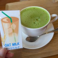 Oat milk card brought up alongside my drink at and bull coffee - アンド ブル コーヒー in Kyoto