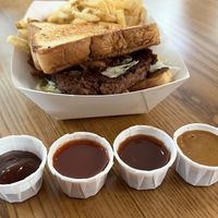 All four BBQ sauces offered are vegan!  at Walt Disney World - Regal Eagle Smokehouse in Lake Buena Vista