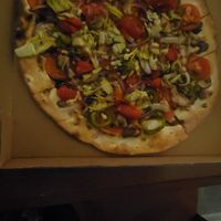 Silver Fern flatbread is hearty with veggies. Kept as no cheese although they offer vegan cheese for upcharge. at The Filling Station Microbrewery in Traverse City