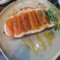 Sourdough bread with smoky carrots and hummus at Café Láska in Vienna
