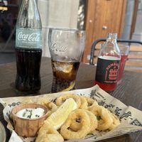 Calamari outside tables.  But if you prefer you can dine inside   at Mad Mad Vegan - Barcelona in Barcelona