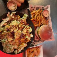 Cheese sticks, special burger, and Caesar salad.   at Mad Mad Vegan - Barcelona in Barcelona