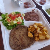 Vegan plate: beans, veggies patty, home fries and avocado salad at Eva's Cafe and Bar at Mango Inn in Utila