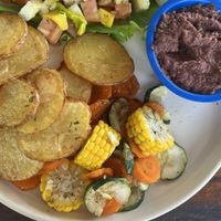 Avocado salad, beans, rasemary potatoes and mixed vegetables  at Eva's Cafe and Bar at Mango Inn in Utila