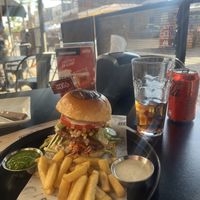 Vegan „beef“ burger, fries are included with two different dips. I asked if everything about it was vegan and they reassured me. It was super tasty and filling!  at Hell Street Bar in Iquique