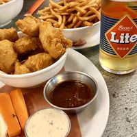 Plant Based Chicken Less Wings, fries and Beau’s Lite Beer  at Beertown Public House in Toronto