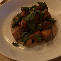 Sweet potato bravas with pickled lime and mint at Little Wolf Restaurant in Edmonton