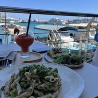 White pasta and green toast  at FRESHA in Limassol