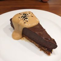 Chocolate carob caramel cake  at UMAMI Plantbased in Barcelona