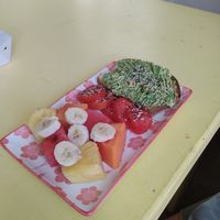 Vegan avocado toast with fruit at Josie's  in Utila