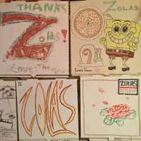 painted pizza boxes on the walls : ) at Zola's Pizzeria in Brookings
