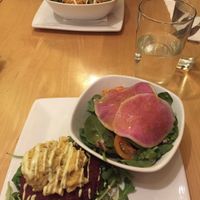 Beetroot burger topped with vegan mac and cheese. 
Served on a bed of arugula because I didn't want a bun. 
Side salad with yummy watermelon radishes.  at Great Sage in Clarksville