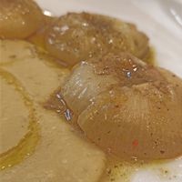  an Italian specialty: roasted flat onions, served on a bean purée, very original. at Il Lughino in Milan