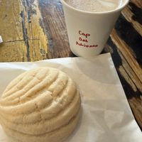 Concha and oat milk cappucino   at Catahoula Coffee Co in Richmond