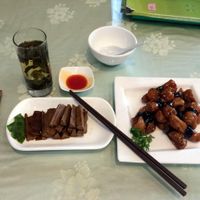 Lunch at Hui Yuan Vegetarian. Complimentary Oolong tea (and refills). Mock meat menu items. This lunch came to about 48 yuan. at Huì Yuán Sù Shí Fāng 慧缘素食坊 Lotus Vegan in Shanghai