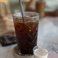 Iced Americano with oat milk   at Aubrie's Plant-Based Cuisine in El Nido