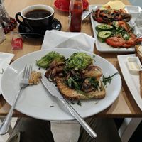 The vegan breakfast had mushrooms,sweet peppers,vegan cheese,a whole avocado,cucumbers,tomatoes and olives, plus 2 slices of bread at Evina's Coffee Shop in Seaford