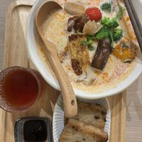 Spicy ramen with side of radish cake  at JiuSuo Plant-based Eatery - 玖所 in Kaohsiung