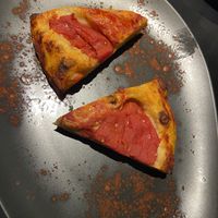 Spicchi di Focaccia barese pomodoro e olive  at L'Aforisma in Turin