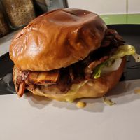 Grand Kiff: A burger of your choice, a 100% plant-based ham or bacon croque with a melt-in-the-mouth plant-based alternative to cheddar cheese, all served with crispy waffle fries. at Dirty Vegan Burgers by Taster in Paris