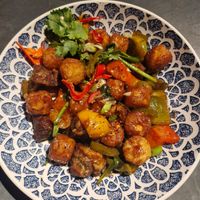 Vegan Bridgewater Breakfast Hash: Vegan sausage, rainbow peppers, house brown sauce, baby spinach, jalapenos and potato tots. at MAN - Bridgewater Exchange - T2 in Manchester