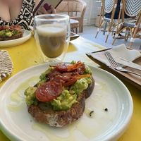 Avocado toast with roasted tomato & oat milk coffeee  at Island Deli in Siargao