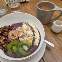 Acai bowl with breakfast tea and oat milk at 718 Breakfast & Brunch in Sofia