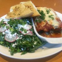 veggie lasagna and arugula salad at Stella's - Plug In in Winnipeg
