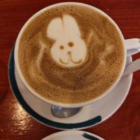 Dirty chai latte with cute easter themed latte art at Apricot Coffee in Budapest