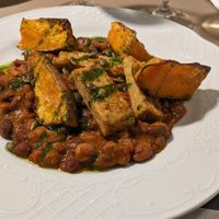 Spicy chili with mushrooms and pumpkin as vegan main course at Restaurante SUHAZI Jatetxea in San Sebastian