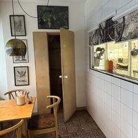 Bathroom and see through kitchen  at Gotuyam Local in Poznan