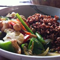 Cashew Ginger Tofu (tofu, greens sautéed in aromatic spices and it comes with red rice)
 at The Garden Kafe at The Yoga Barn in Ubud