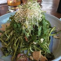 Basil sunflower pesto with olives, cherry tomatoes, rucola, zucchini noodles and bits of cheesy sundried tomato crumbles at The Garden Kafe at The Yoga Barn in Ubud