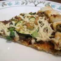 Mosaïque pizza with zucchini, green peppers, mushrooms, green olives, green onions and Daiya cheese. Pretty good. at Vegan Rapide - Sherbrooke in Montreal