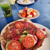Breakfast baleada, sort of an open face burrito w fresh ripe fruit bowl total $5  at Yahongreh? in Roatan
