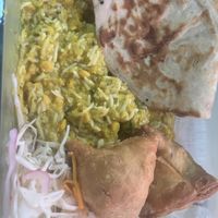 Takeout vegan naan, samosas, and Dal Tadka curry  at Noor Kitchen & Cocktails in Greensboro