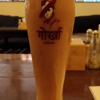 Places' house smoothie (banana, papaya, seasonal fruits. Coconut milk) at Places Restaurant and Bar in Kathmandu