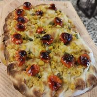 Ceci schiacciati alle erbette mediterranee, capperi e pomodorini confit at Casa Birra Puddu  in Santa Giusta